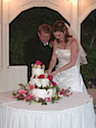 Rebecca and Brian cutting the cake.