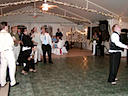 The groom throughs the garter. Notice the guys not trying to catch it